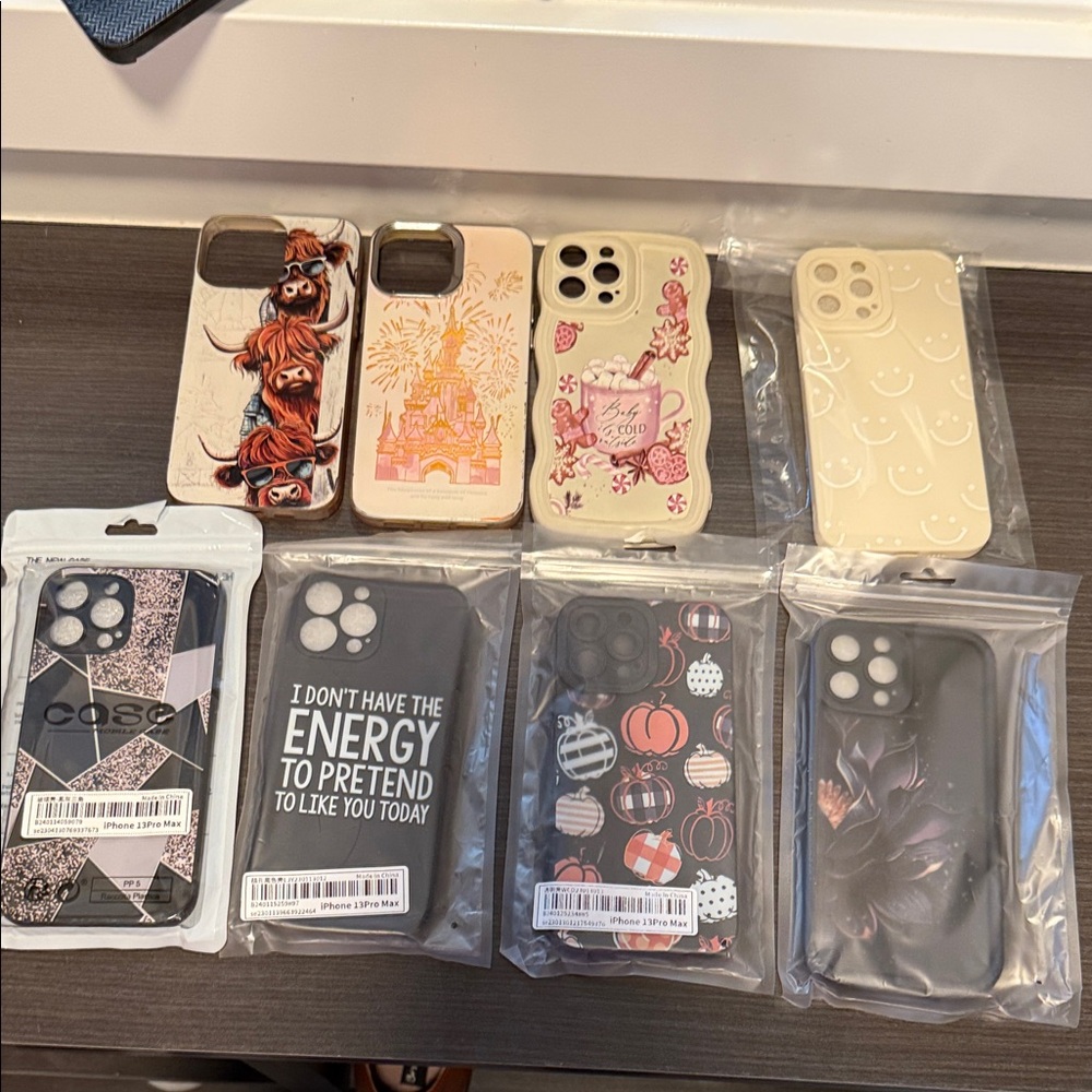 Assorted iPhone Cases - Black, Cream, and Multicolor Designs